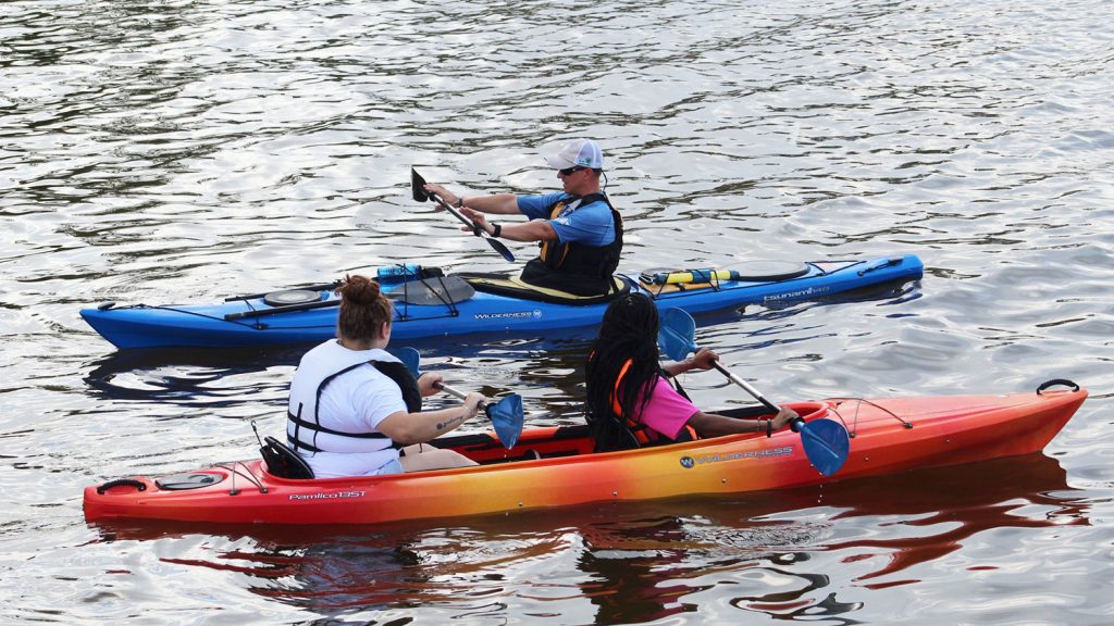 people in kayaks