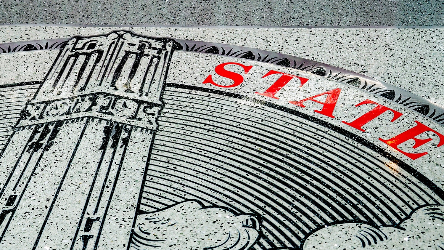 Close up of university seal on the floor of the Talley Student Union.