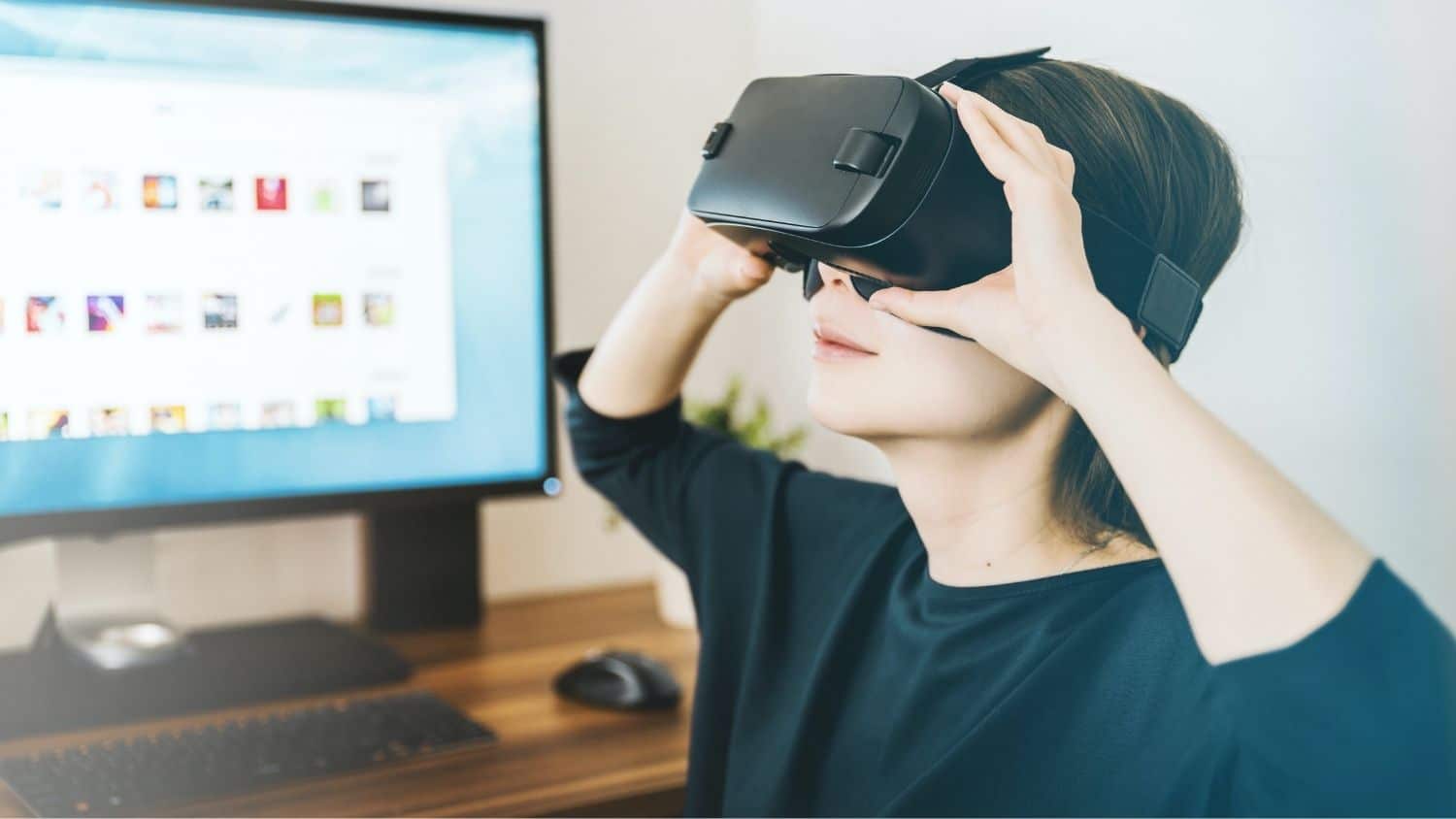 Woman wears virtual reality headset.