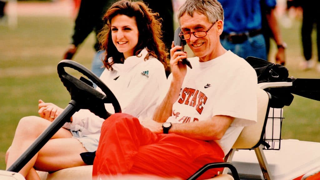 Laurie Henes, shortly after being hired as assistant coach, sits with head coach Rollie Geiger, circa 1996.