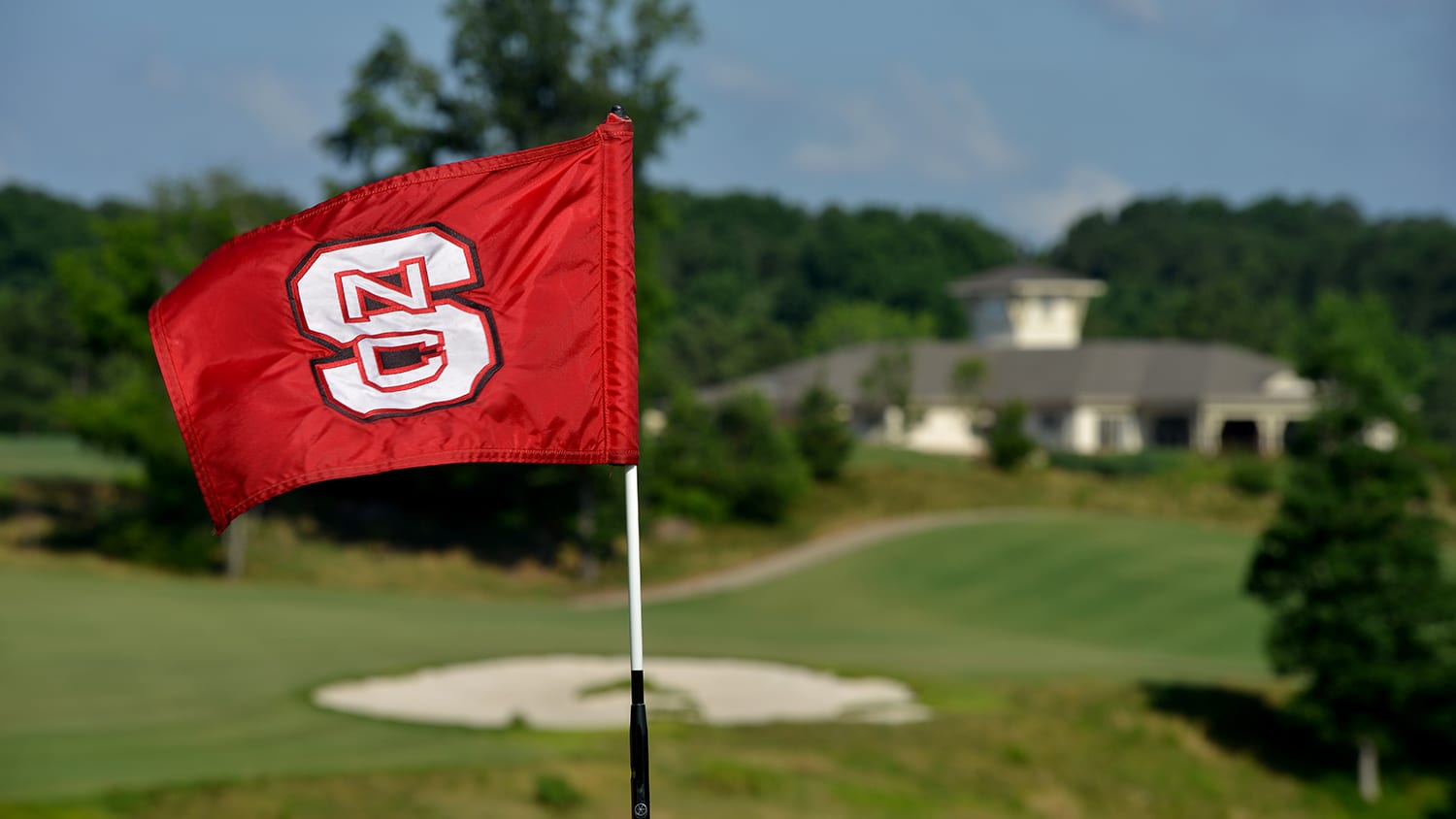 Flag waves on a green at Lonnie Poole Golf Course.