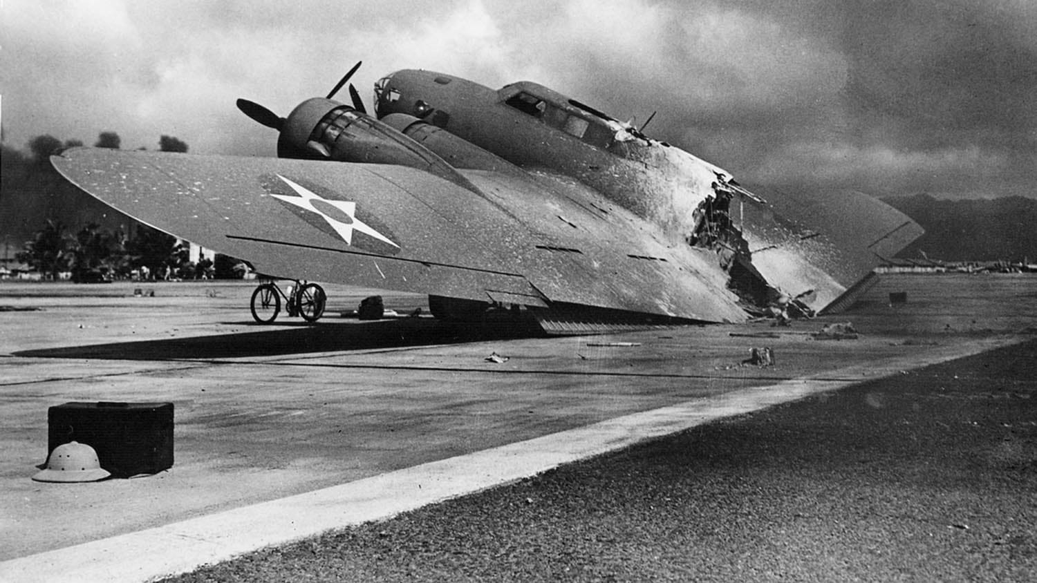 A burned U.S. Army Air Forces Boeing B-17C Flying Fortress rests near Hangar 5, Hickam Field, Oahu, Hawaii on Dec. 7, 1941. Photo: National Archives.