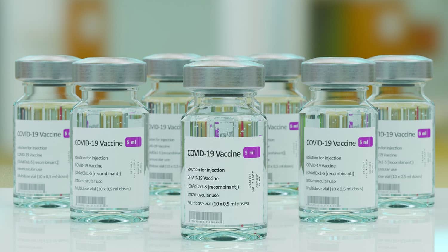 vials of covid-19 vaccine sit on a counter