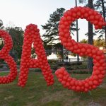 A BAS sign made of red balloons.