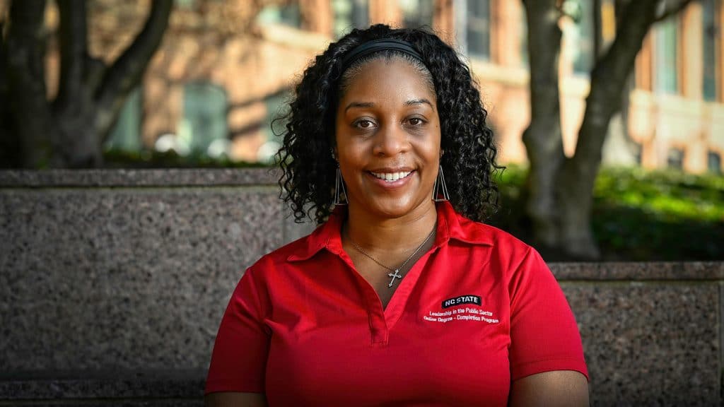 LaShica Waters in front of academic building on campus.