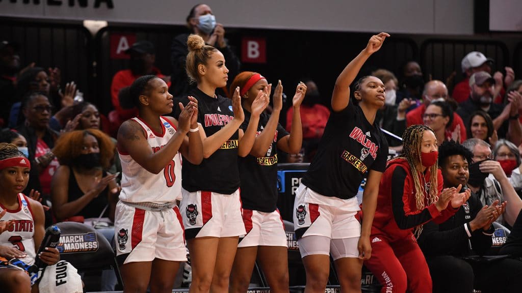 NC State's bench players show their support for the Wolfpack at Reynolds Coliseum.