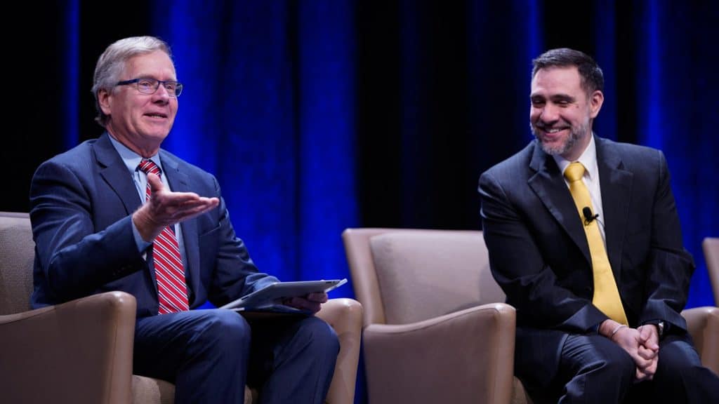 Boney, left, with Roberto Gallardo at the Reconnect to Technological Opportunity forum in February 2020.