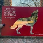 A Day of Giving frame with a wolf cutout.
