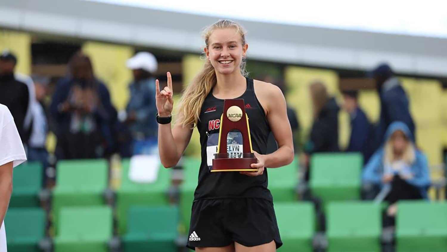 Sophomore Katelyn Tuohy shows off her trophy after winning the NCAA 5,000-meter championship in Eugene, Oregon.