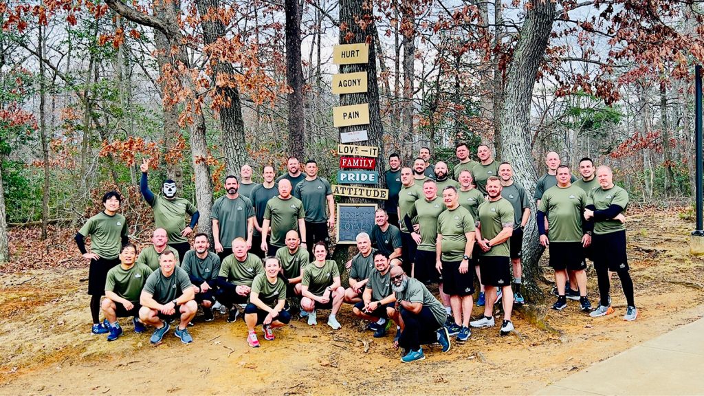 Group shot of police officers outside during a physical training program.