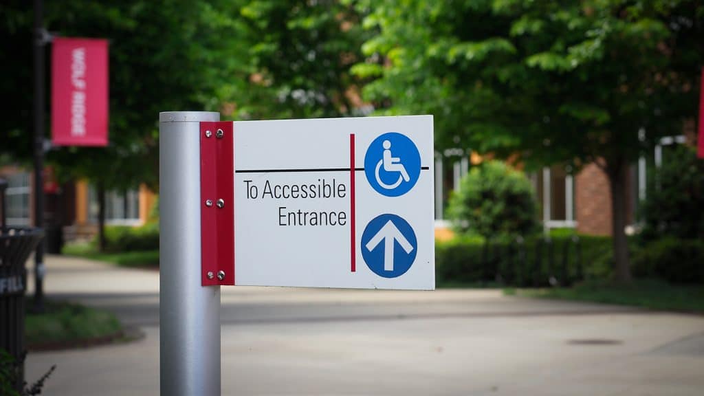 An accessible entrance sign on Centennial Campus.