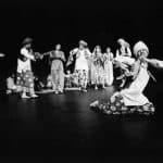 Dancers wearing traditional costumes perform during India night in a black and white archival photo from 1977.