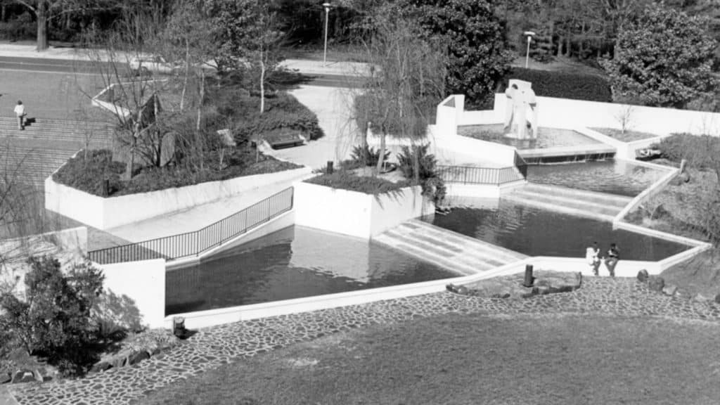 A black and white archival photo shows a large, terraced fountain outside the University Student Center.