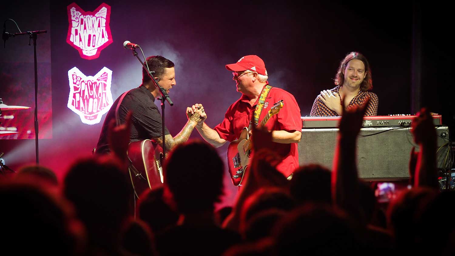Chancellor Randy Woodson plays guitar with BJ Barham, the lead singer of American Aquarium and an NC State alum.