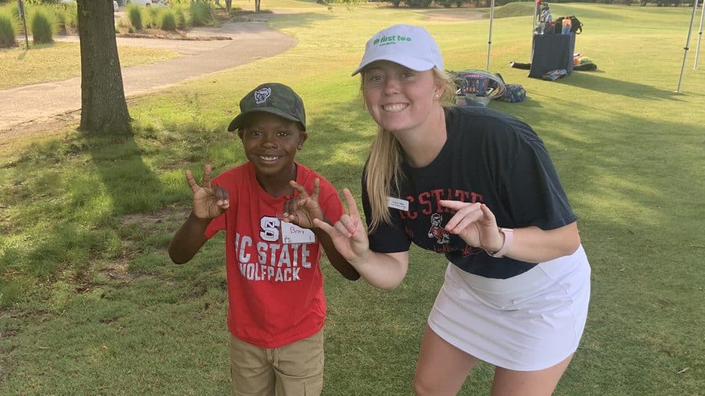 Hailey Miller with a young Wolfpack fan.