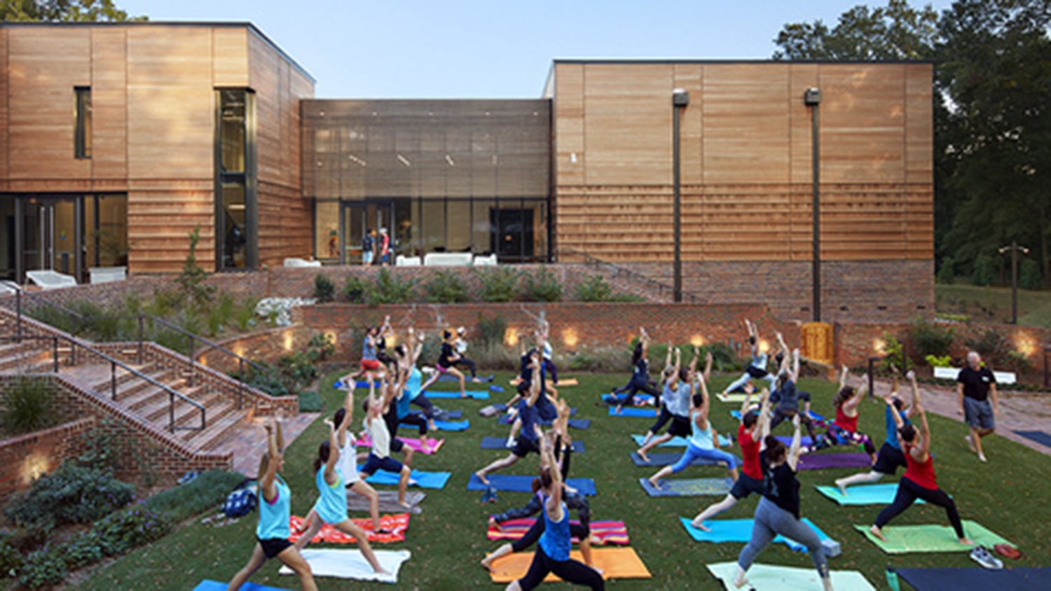 people doing yoga outside at the Gregg Museum