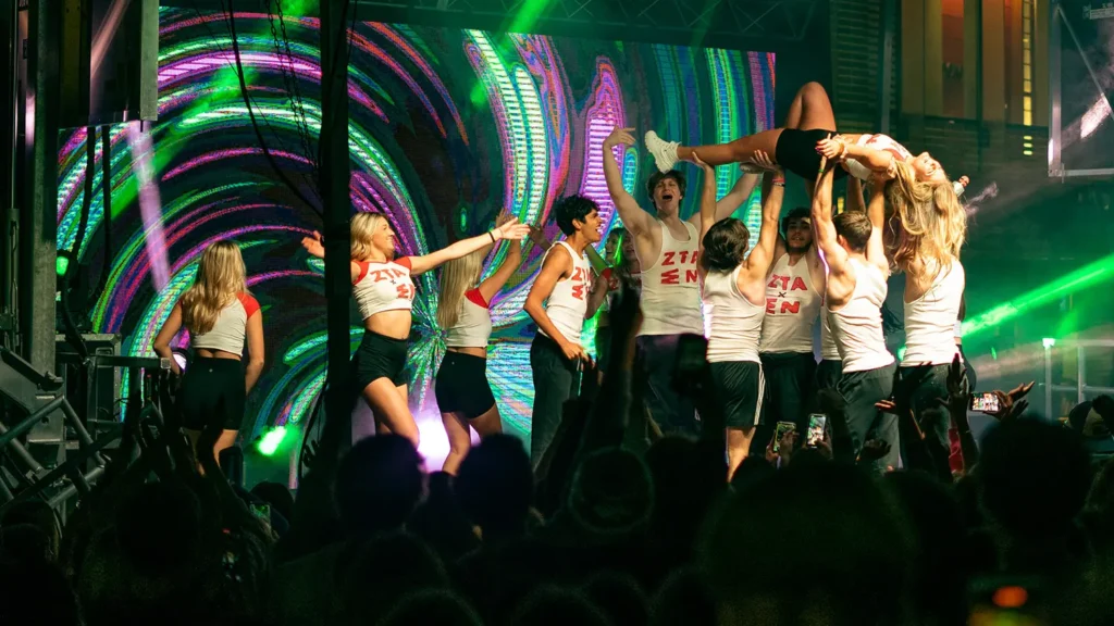 A performer is lifted by her fellow dancers during a performance at NC-SYNC.