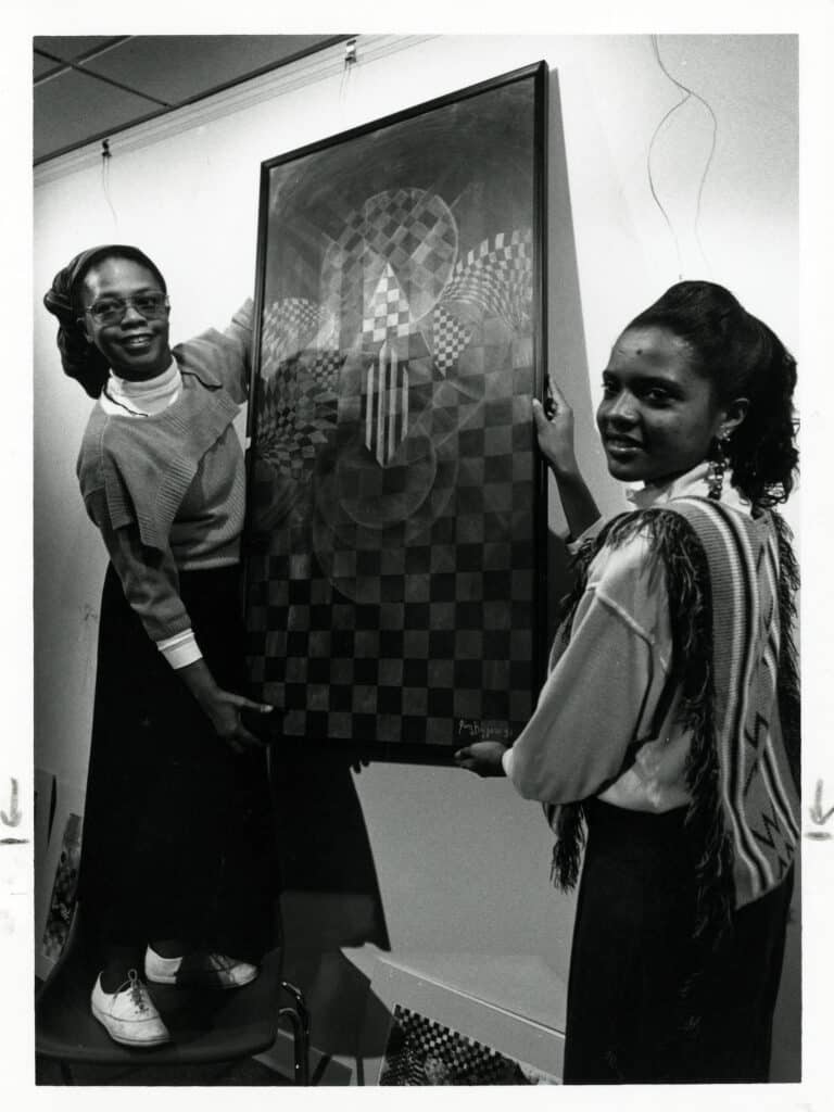 Dr. Iyailu Moses and student Angela Graham at the opening of the African American Center in 1992.
