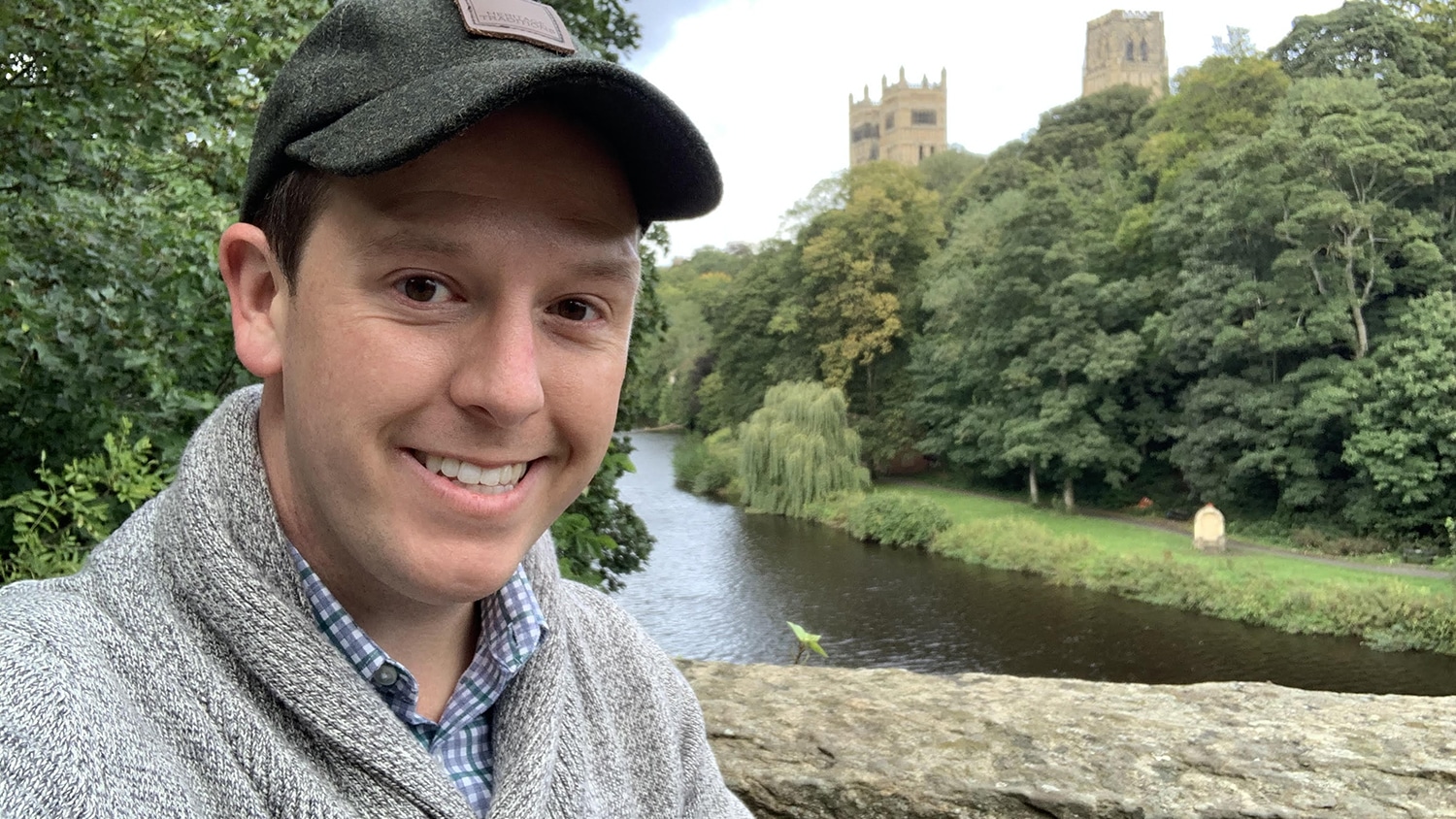 John Coggin poses outside in the peaceful English countryside.