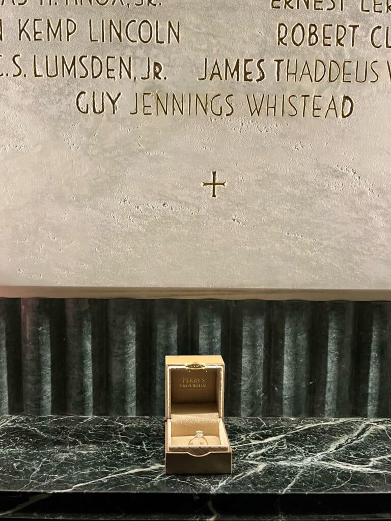 An engagement ring sits below the memorial plaque inside the Memorial Belltower