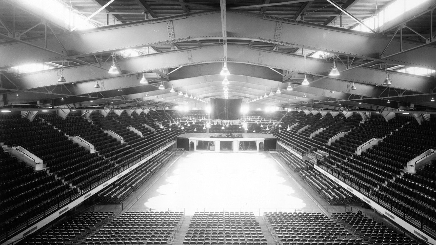 An archival photo shows ice on the floor in Reynolds Coliseum.