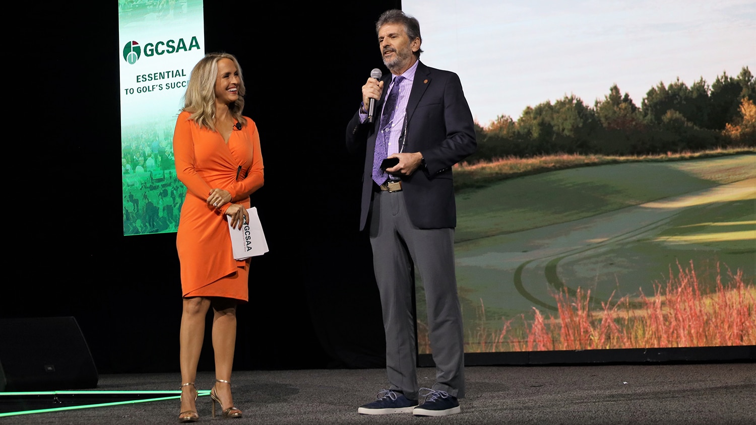 Fred Yelverton accepting an award on stage at a trade association event in Orlando, Florida.