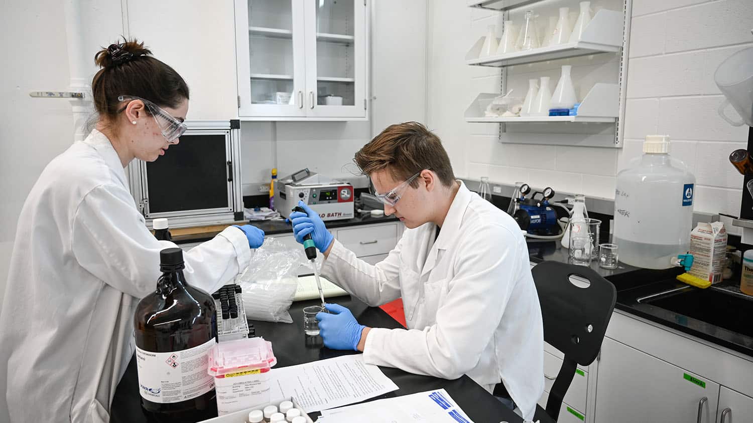 Students work with samples in the Hydraulics Lab in Fitts-Woolard Hall on Centennial Campus; hands-on experience is a core component of student research.