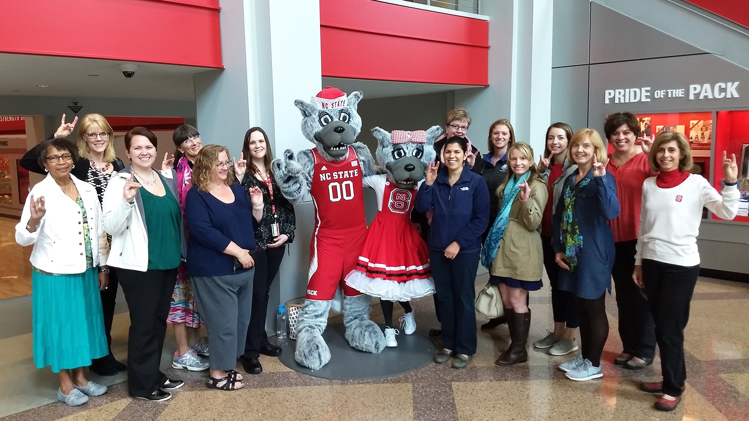 members of the Staff Women's Network on a tour of Reynolds Coliseum