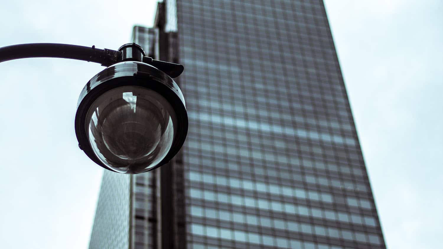 security camera looms over a city street