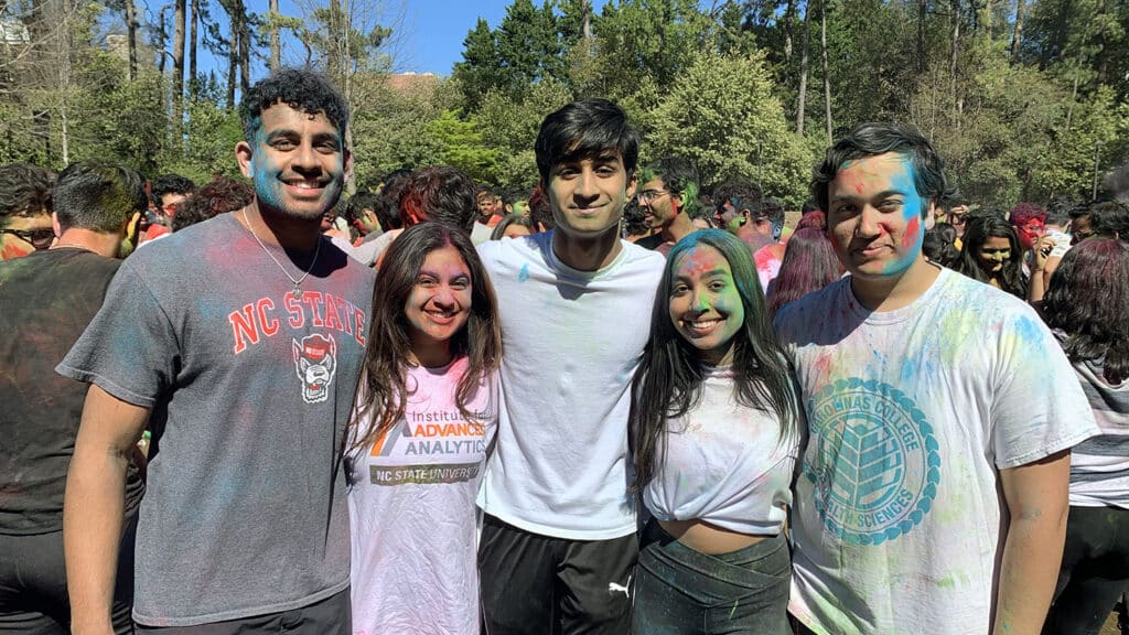 A group of NC State students celebrate Holi on Stafford Commons.