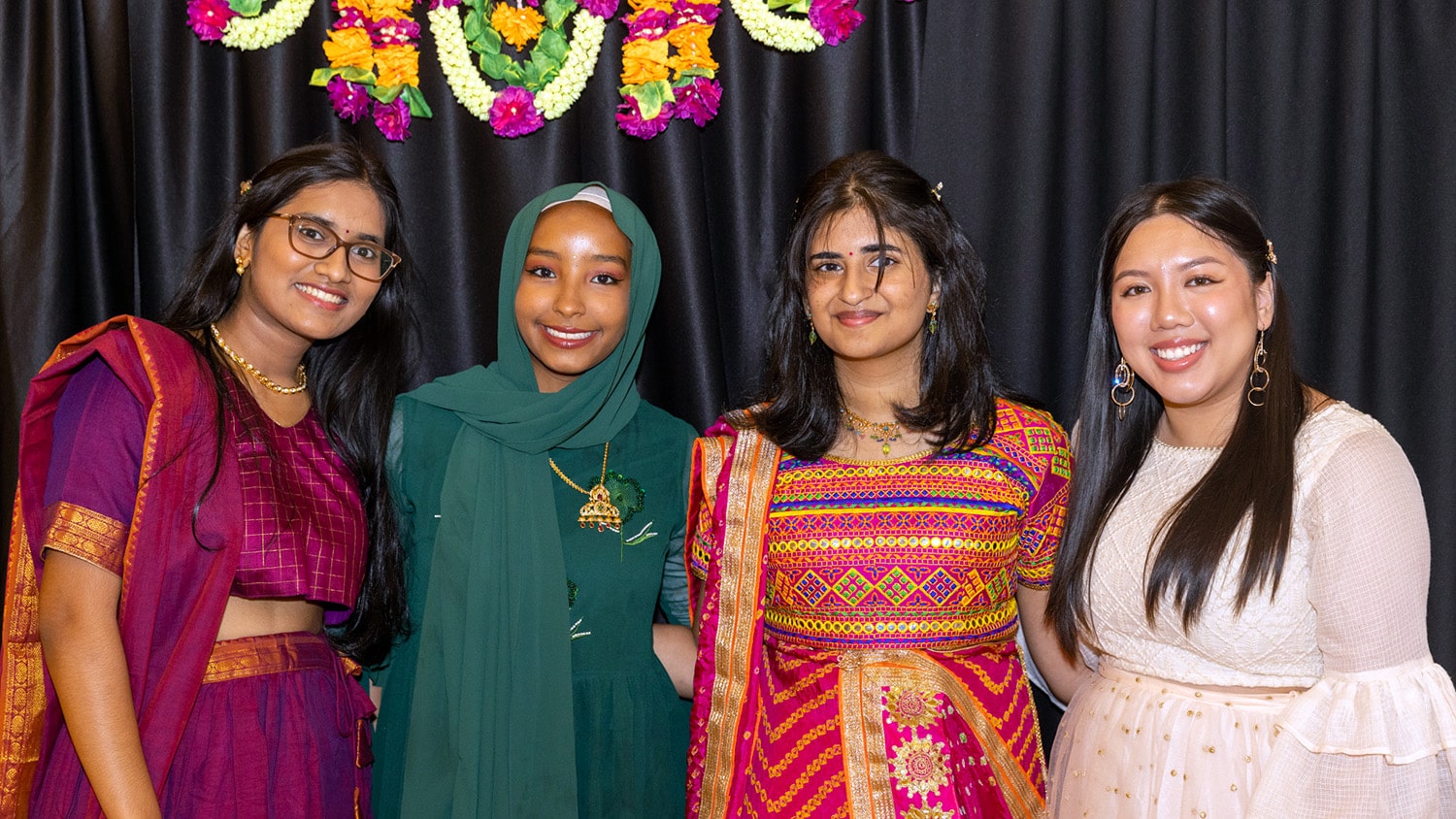 Four NC State students pose at an EKTAA event.