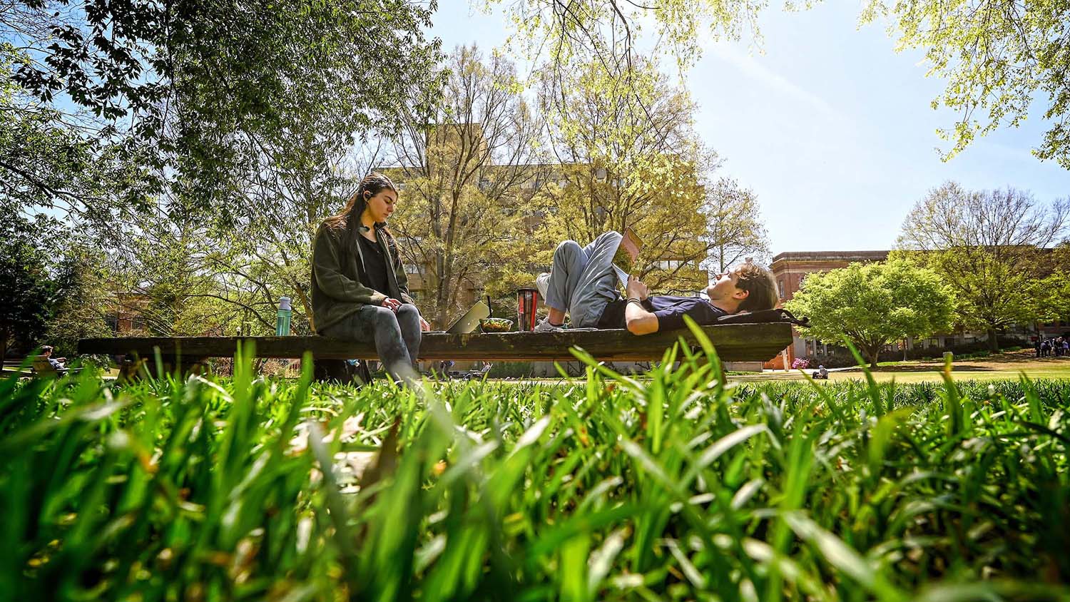 Students soak up the sun — and squeeze in some studying — in the Court of North Carolina.