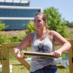Leigh Kathryn Bonner, founder of Bee Downtown, works in an apiary on Centennial Campus.