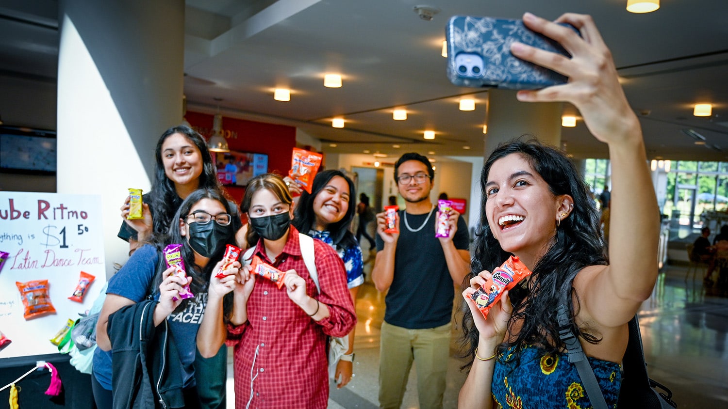 Students snap a quick selfie while tabling in the atrium of Talley Student Union.