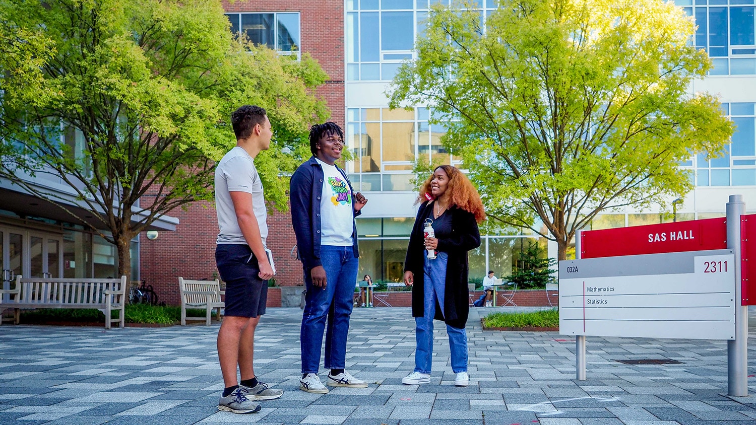 students talking outside of SAS Hall