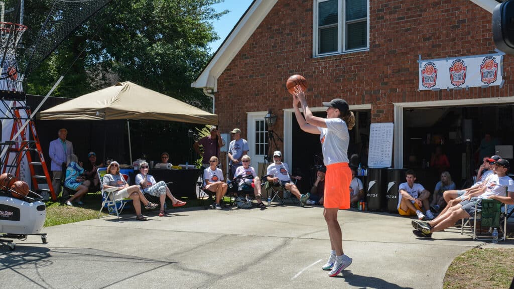 Debbie Antonelli shoots a free throw in her driveway