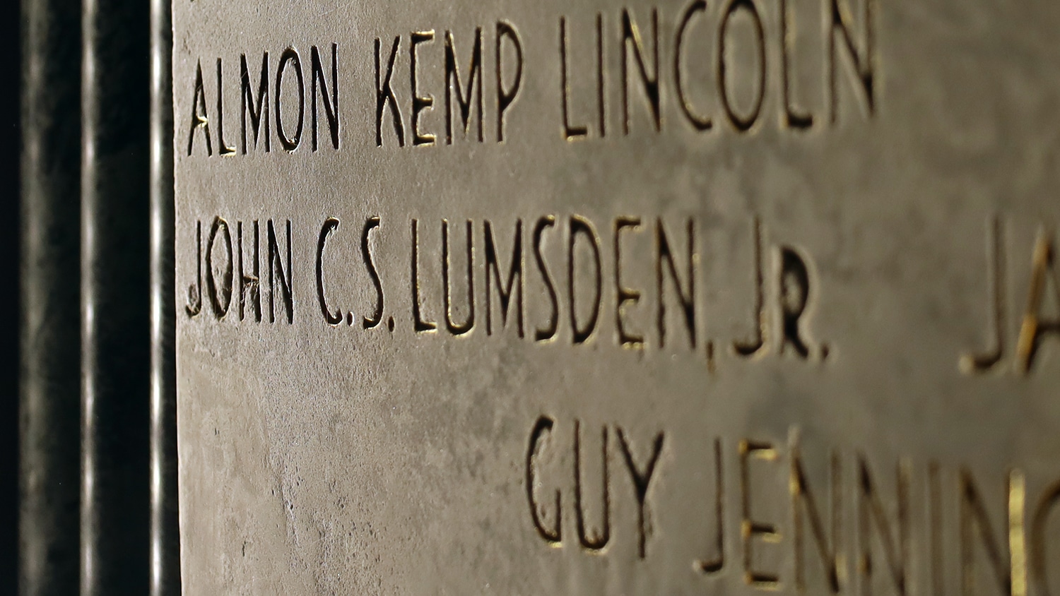 The name John C.S. Lumsden Jr., inscribed in granite