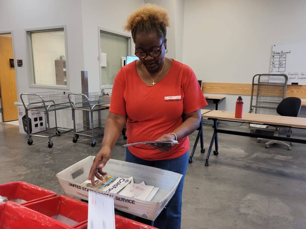 Leggett sorts mail into different bins