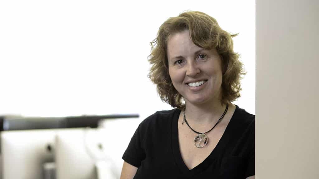 Tiffany Barnes, Distinguished Professor of Computer Science and a coordinator for the Digital Transformation of Education cluster, smiles for the camera in front of a white background.