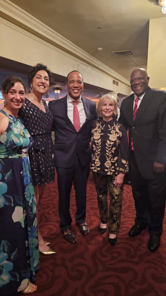 Current men's basketball coach Kevin Keatts (center) with the Valvano family at the event.