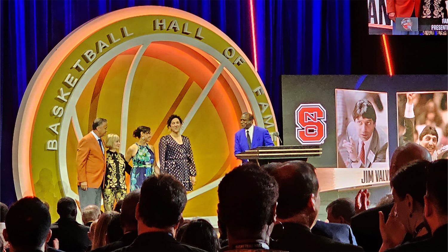 Jim Valvano's wife and daughters on stage at the Naismith Basketball Hall of Fame ceremony