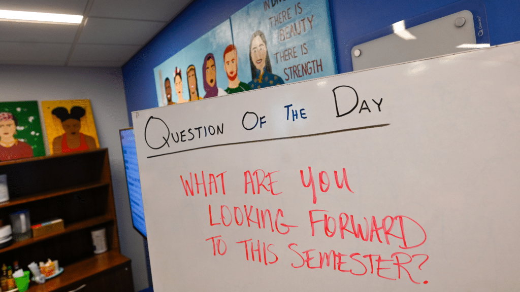 In the office of Multicultural Student Affairs, the question of the day board reads, "What are you looking forward to this semester?".