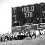 The marching band plays in front of the scoreboard in 1985