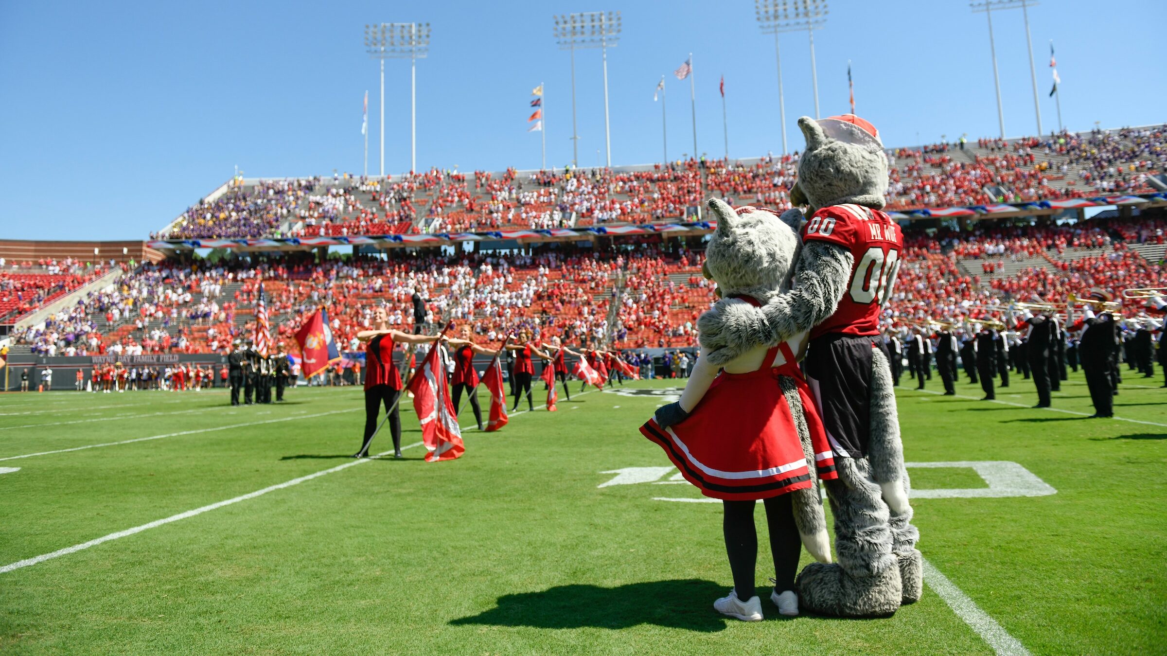Mr. and Ms. Wuf share a moment at Carter Finely Stadium.