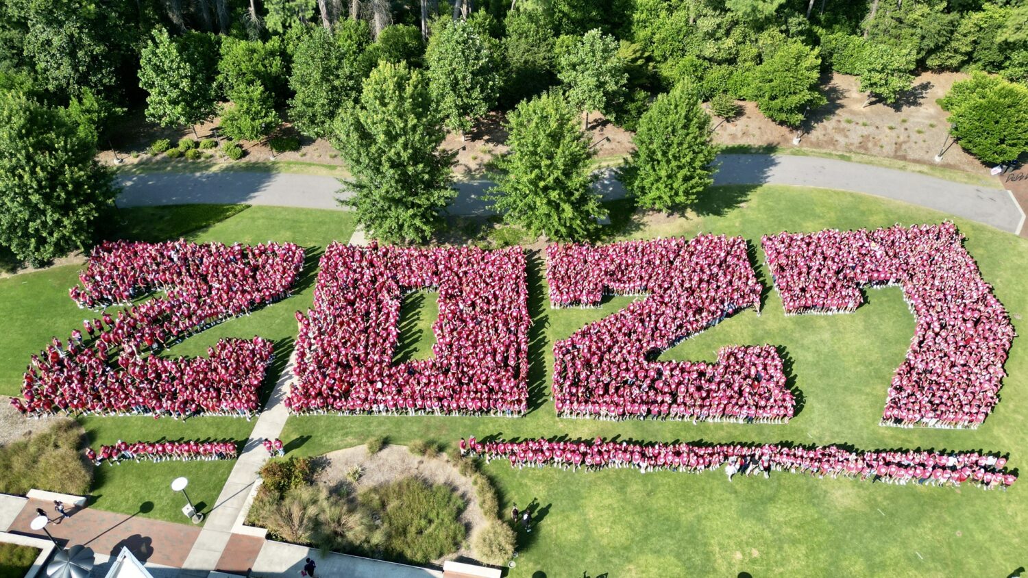 Overhead photo of new students arranged to spell out the number 2027.
