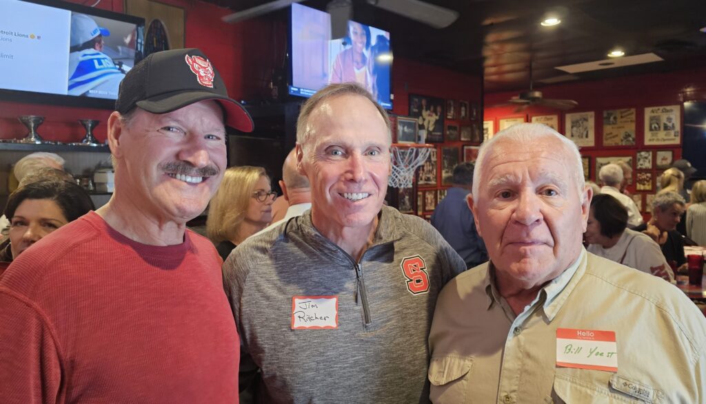 Cowher (left) with former teammates Jim Ritcher and Bill Yoest inside Amedeo's restaurant.