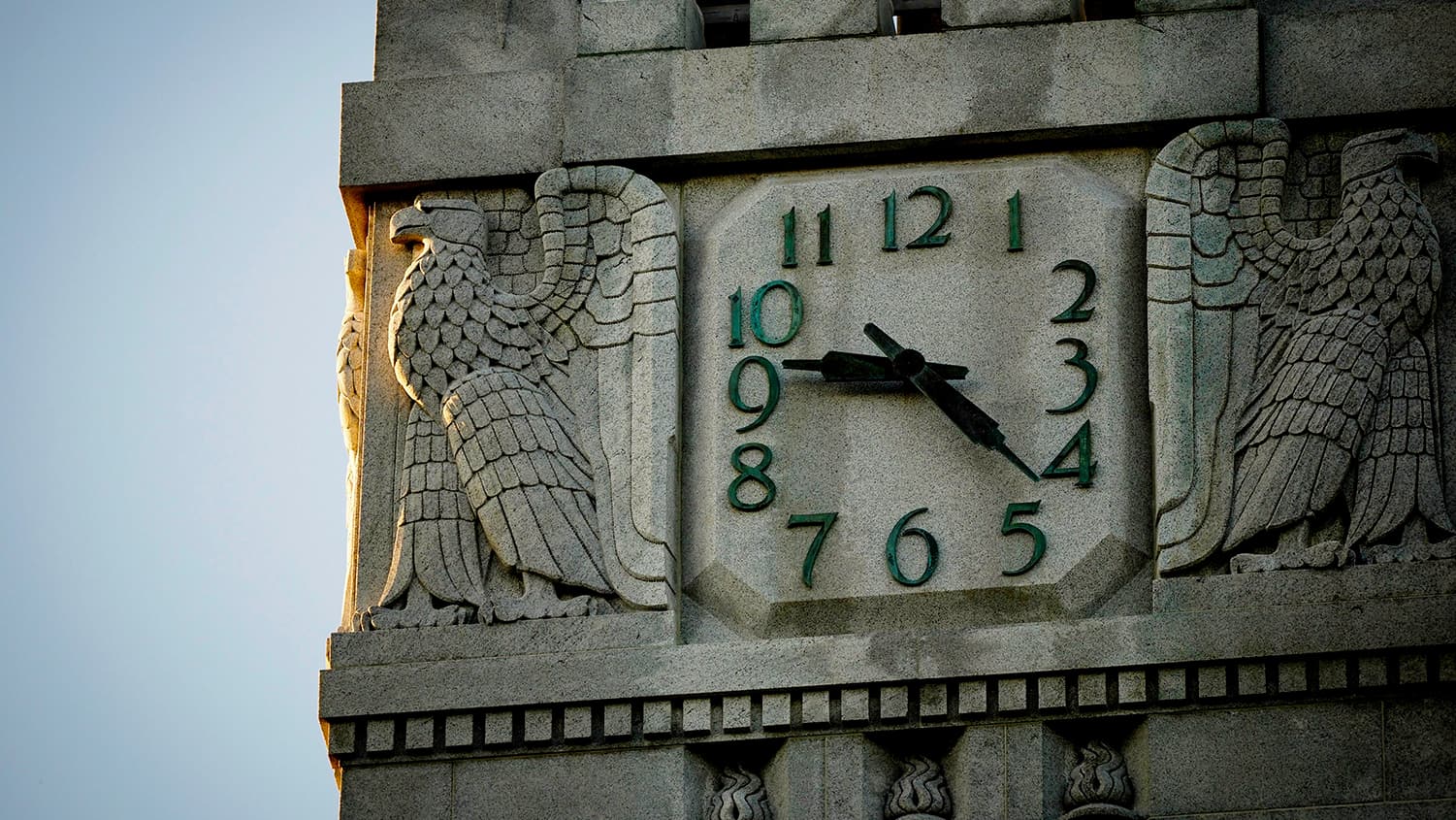Close-up view of the clock at the top of the Memorial Belltower 