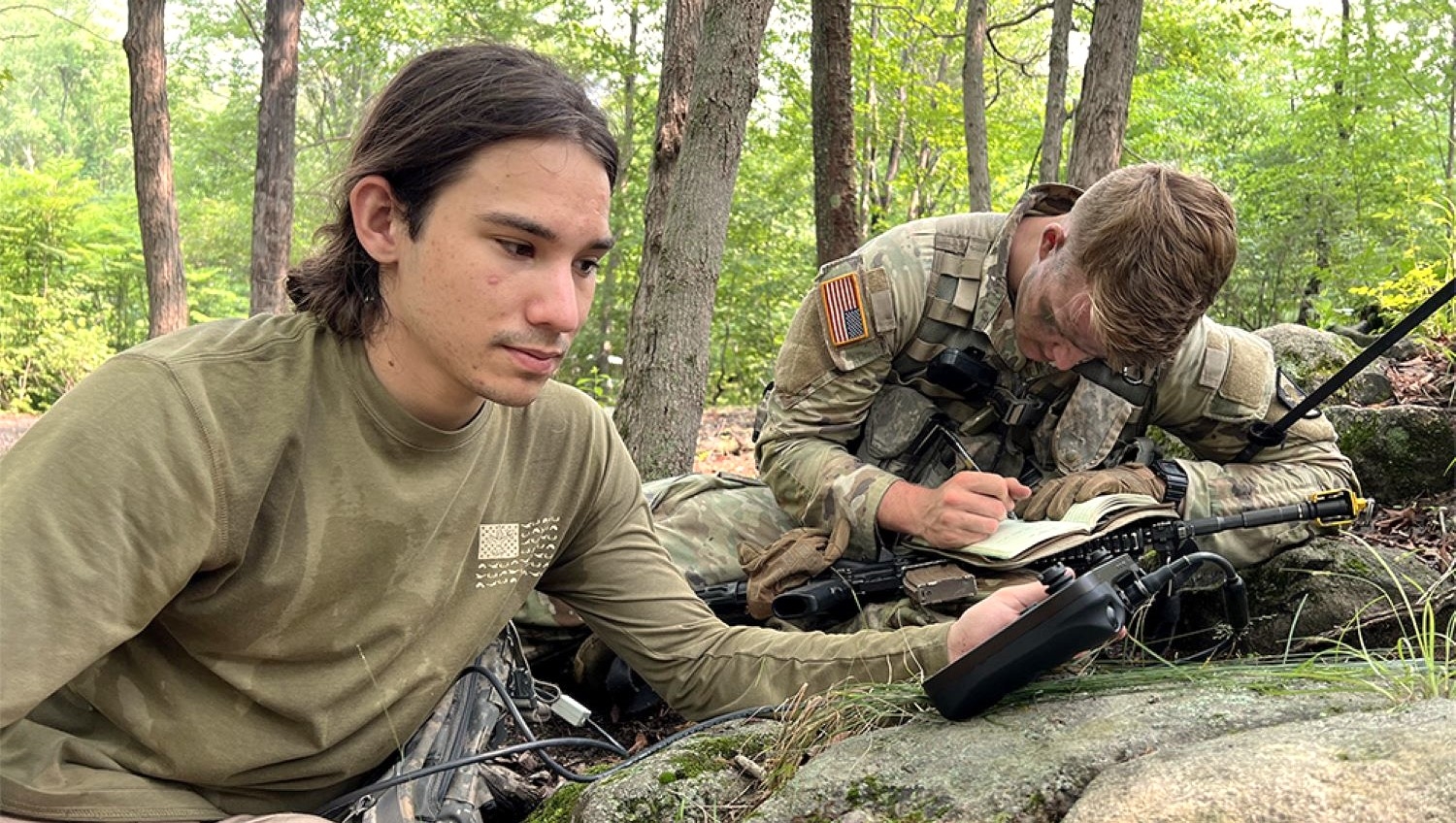 Psychology major Trevor Patten doing fieldwork with a cadet during a West Point training session.