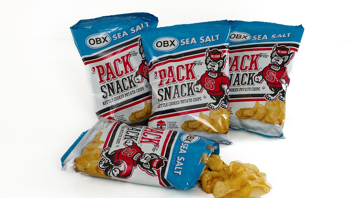 Four bags of 'Pack Snack potato chips, featuring the NC State branding.