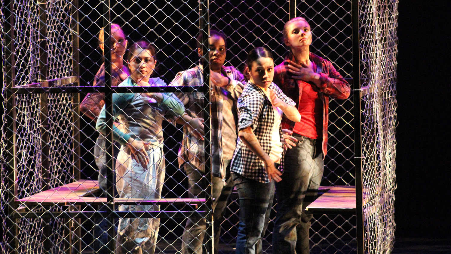 As part of Christa Oliver's production, "Posture of the Heart," several migrant women are seen in a holding cell.